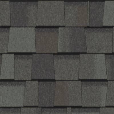 A close up of a roof with a gray shingle.