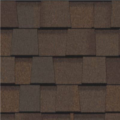 A close up of a brown shingle roof