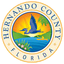 The seal of herndon county florida shows a bird flying over a body of water.