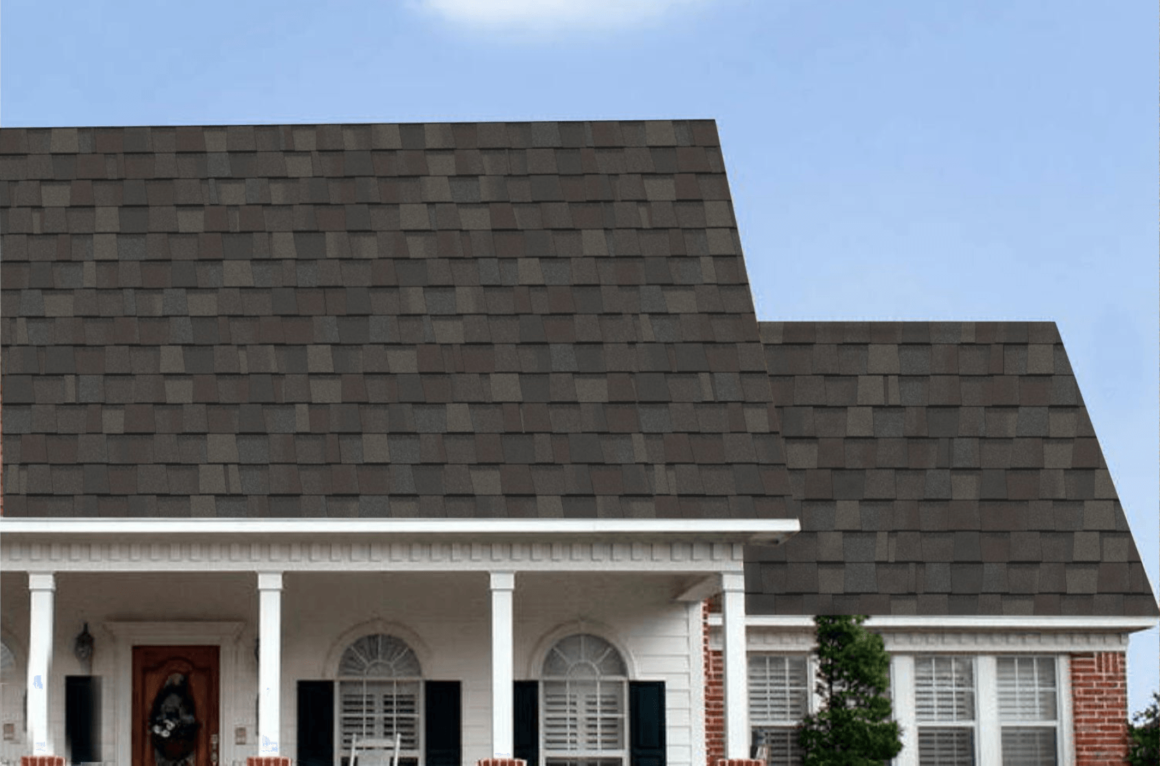 roof repair Tampa. A photo of a house with Driftwood shingles