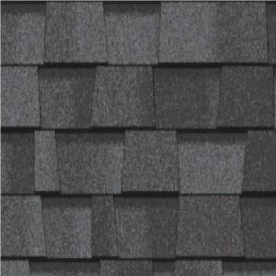 A close up of a roof with a lot of shingles on it.