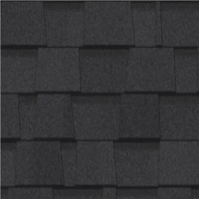 A close up of a black roof shingle.