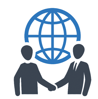 Two men are shaking hands in front of a globe.