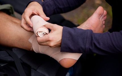 Man Putting Bandage on Foot — Phoenix, AZ — Sotelo Law Group