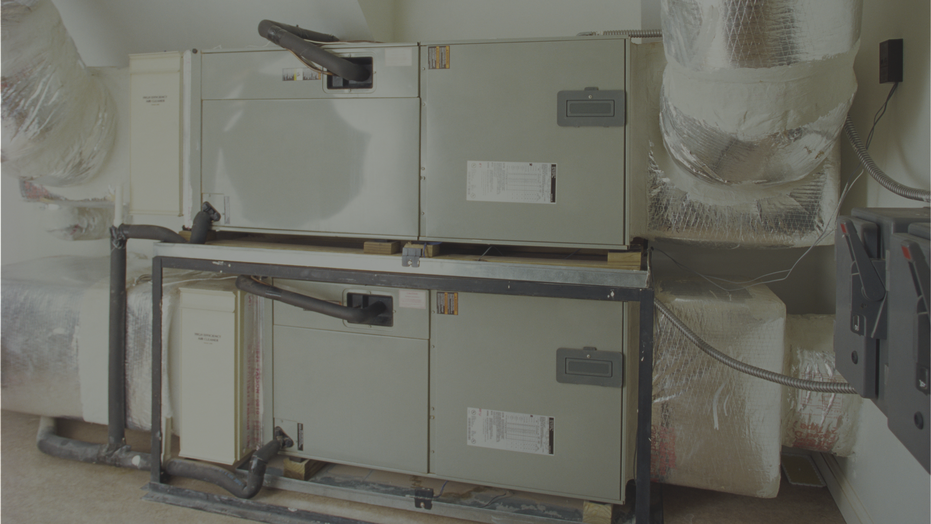 A stack of boxes sitting on top of each other in a room.