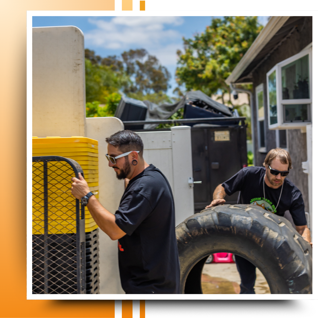 two men working on getting rid a junk