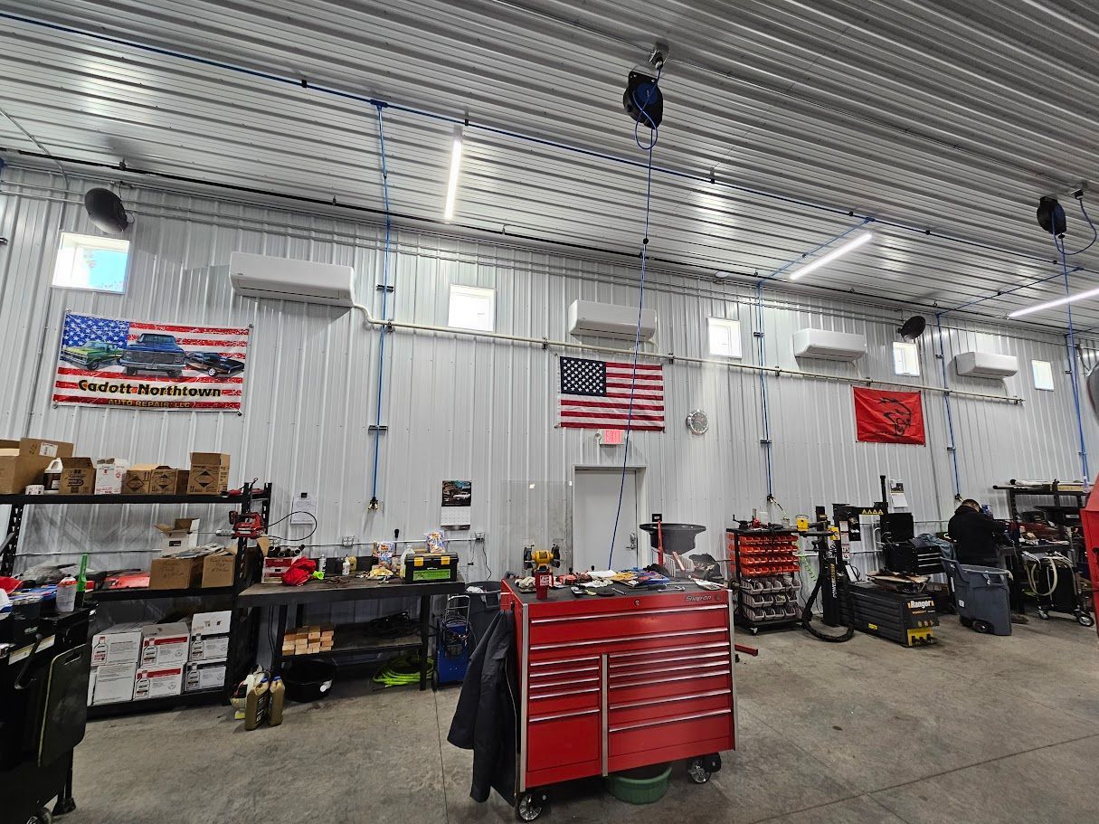 a large garage with a red toolbox in the middle of it .
