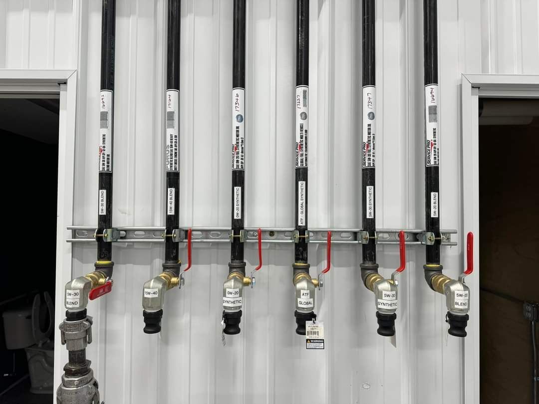 a bunch of pipes are lined up on a wall