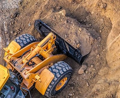 Yellow Colored Excavator — Eugene, OR — McKenzie Excavating And Paving