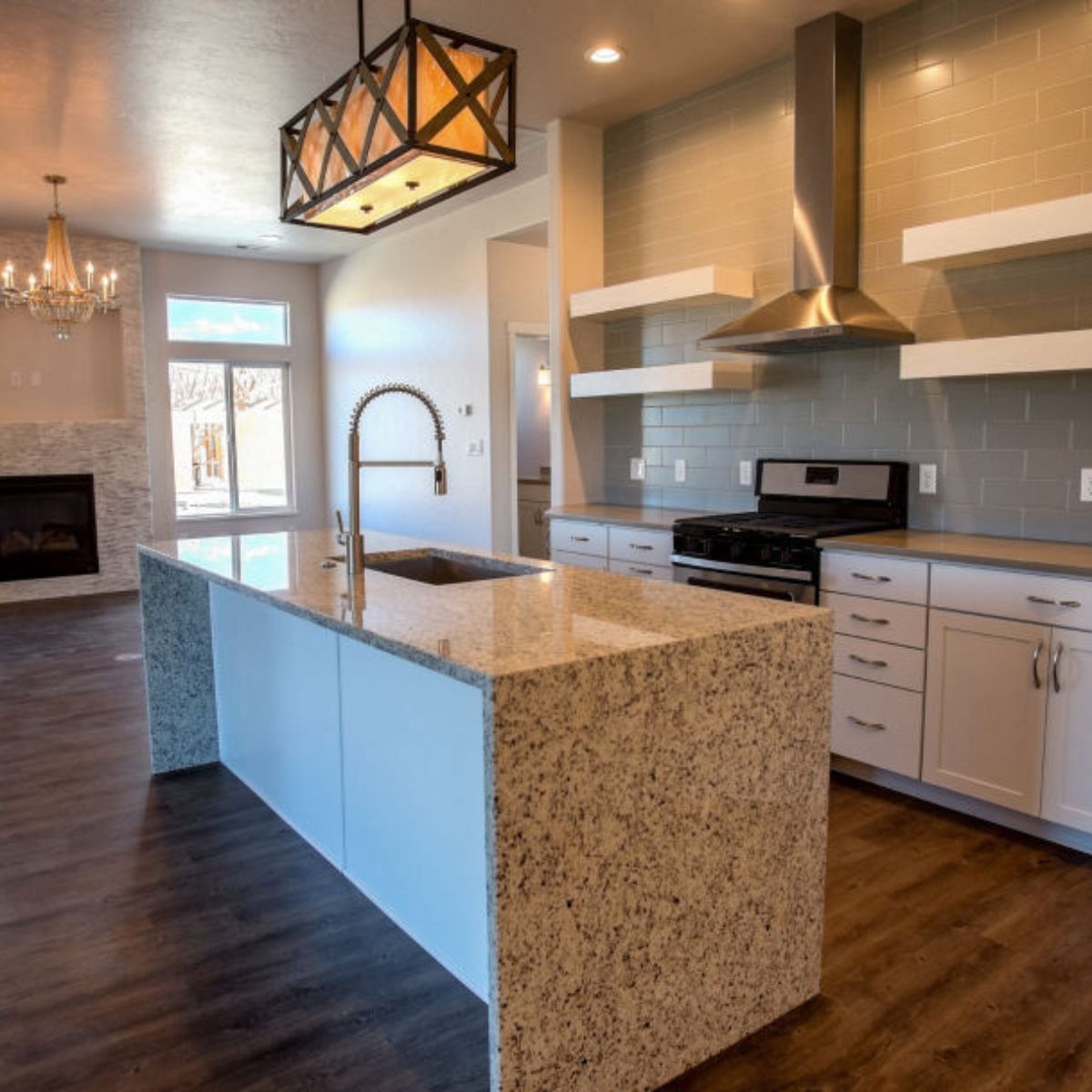 A kitchen with a large island and a stove