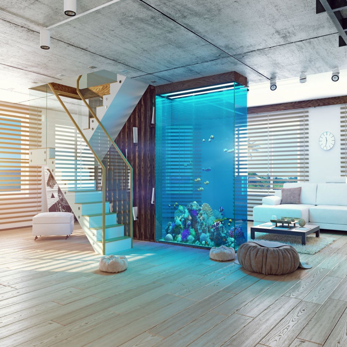 A living room with a staircase and an aquarium