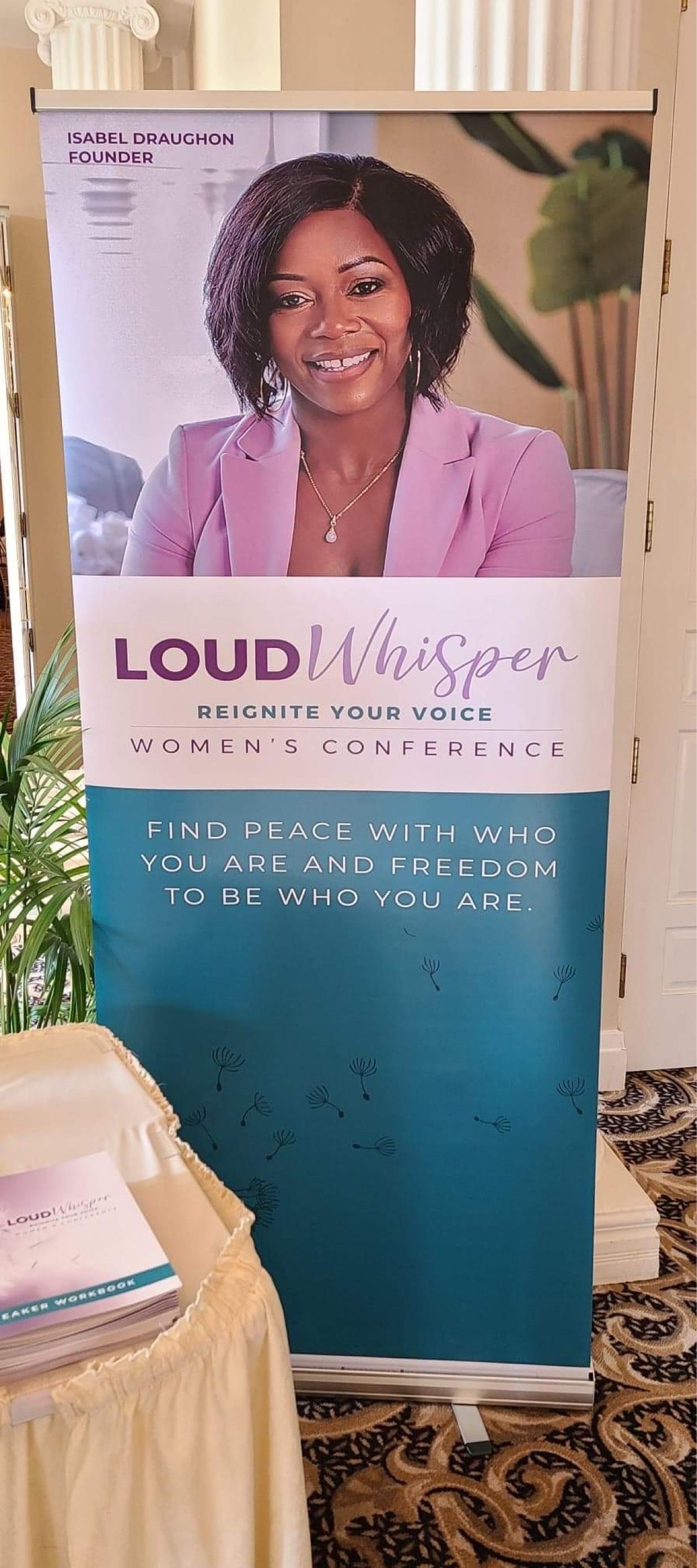 Banner: Woman in pink blazer. 