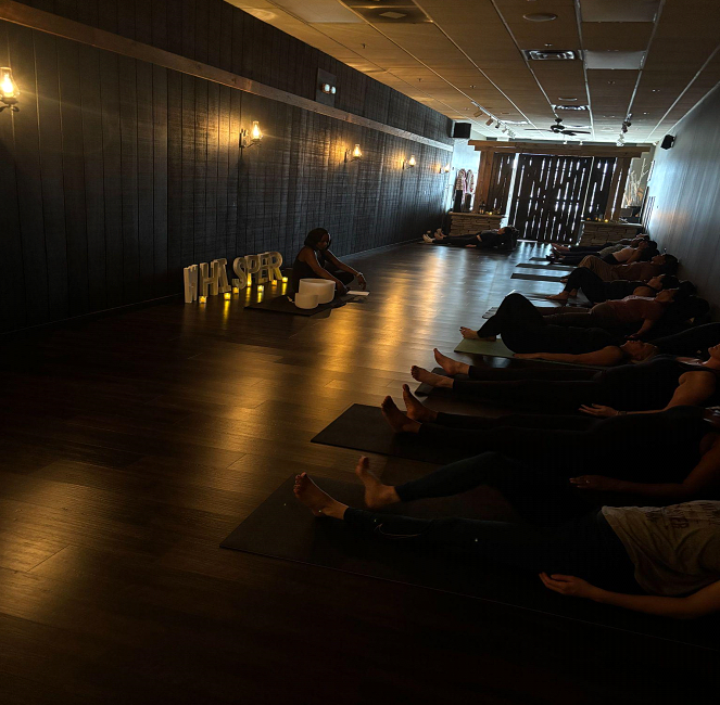 women relaxing in a hallway. 