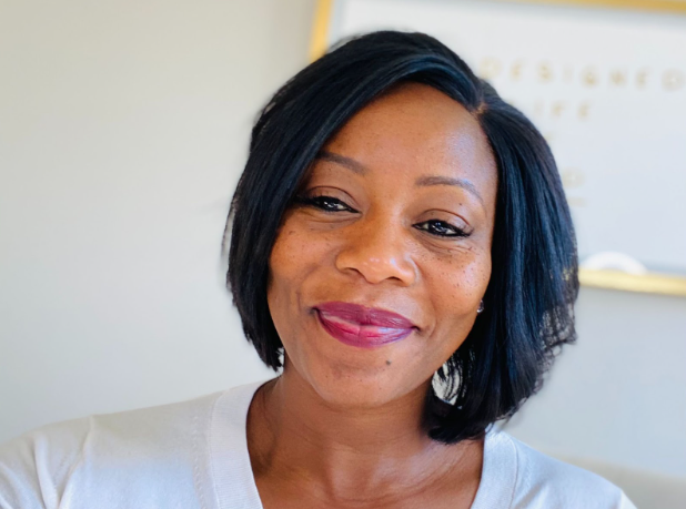 woman facing the camera, smiling. 