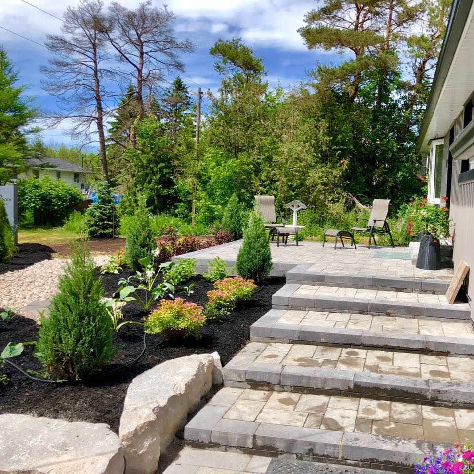 A house with a patio and stairs leading up to it