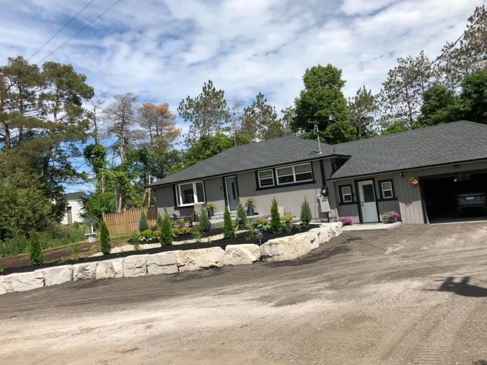 A large house with a car parked in front of it