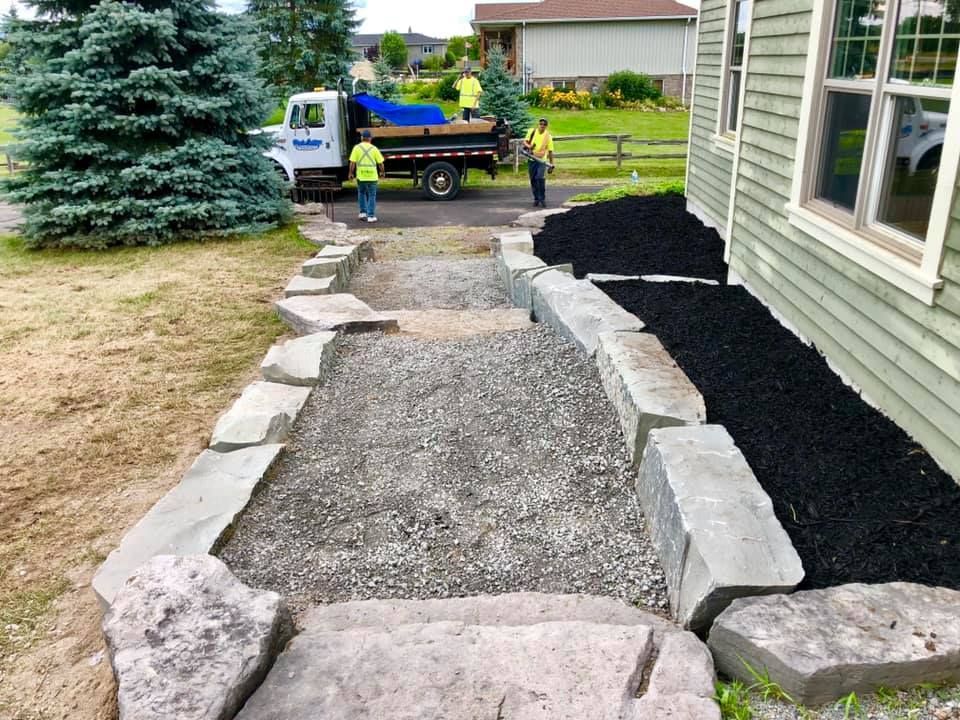 A white truck is parked in front of a house.
