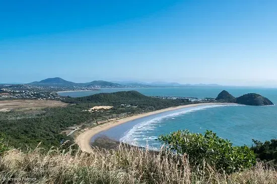 Coastal Landscape with A Sandy Beach, Blue Ocean, Green Hills, and Clear Sky — Keppel Coaches in Barmaryee, QLD