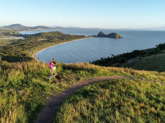 Couple on A Hilltop Trail Overlooking a Bay and Islands — Keppel Coaches in Barmaryee, QLD
