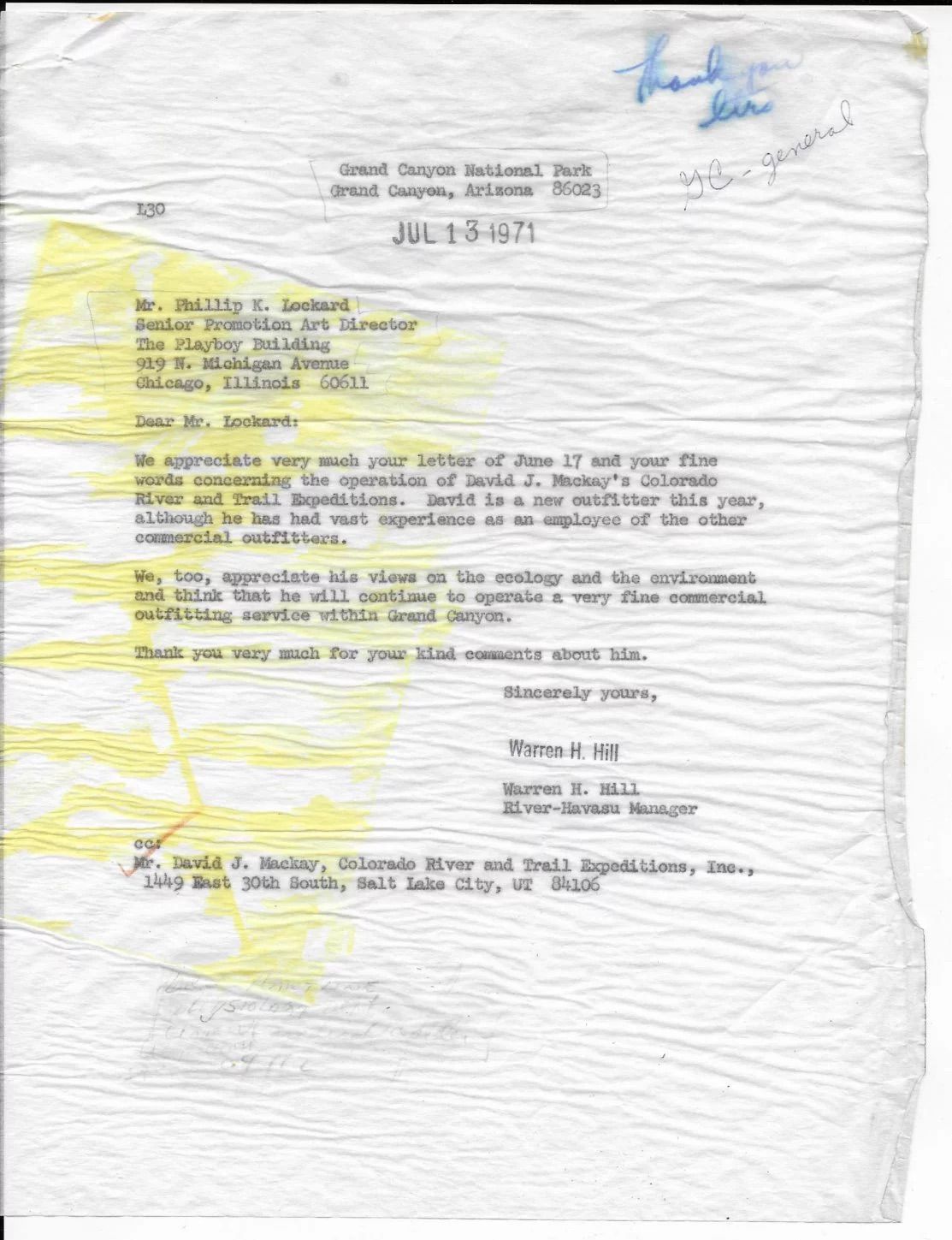 Cataract Canyon River with boats in front of a large rock formation