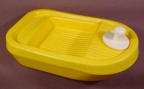 Yellow plastic toy boat with a white duck, likely for a child's bath time.