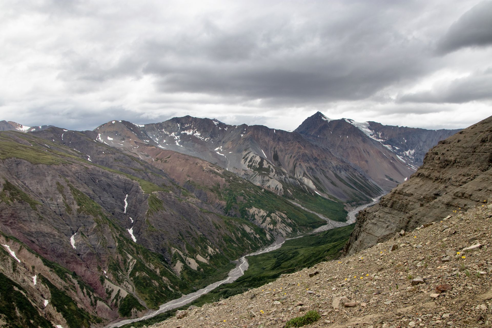 Family taking a photo at the top of the  Desolation Canyon with Green River View at the bottom
