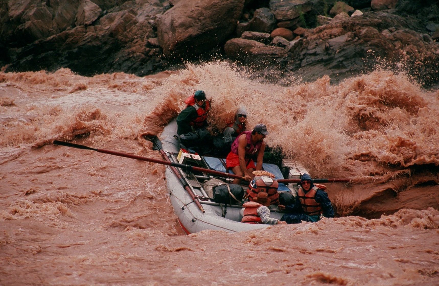 Rafting in a raging brown river