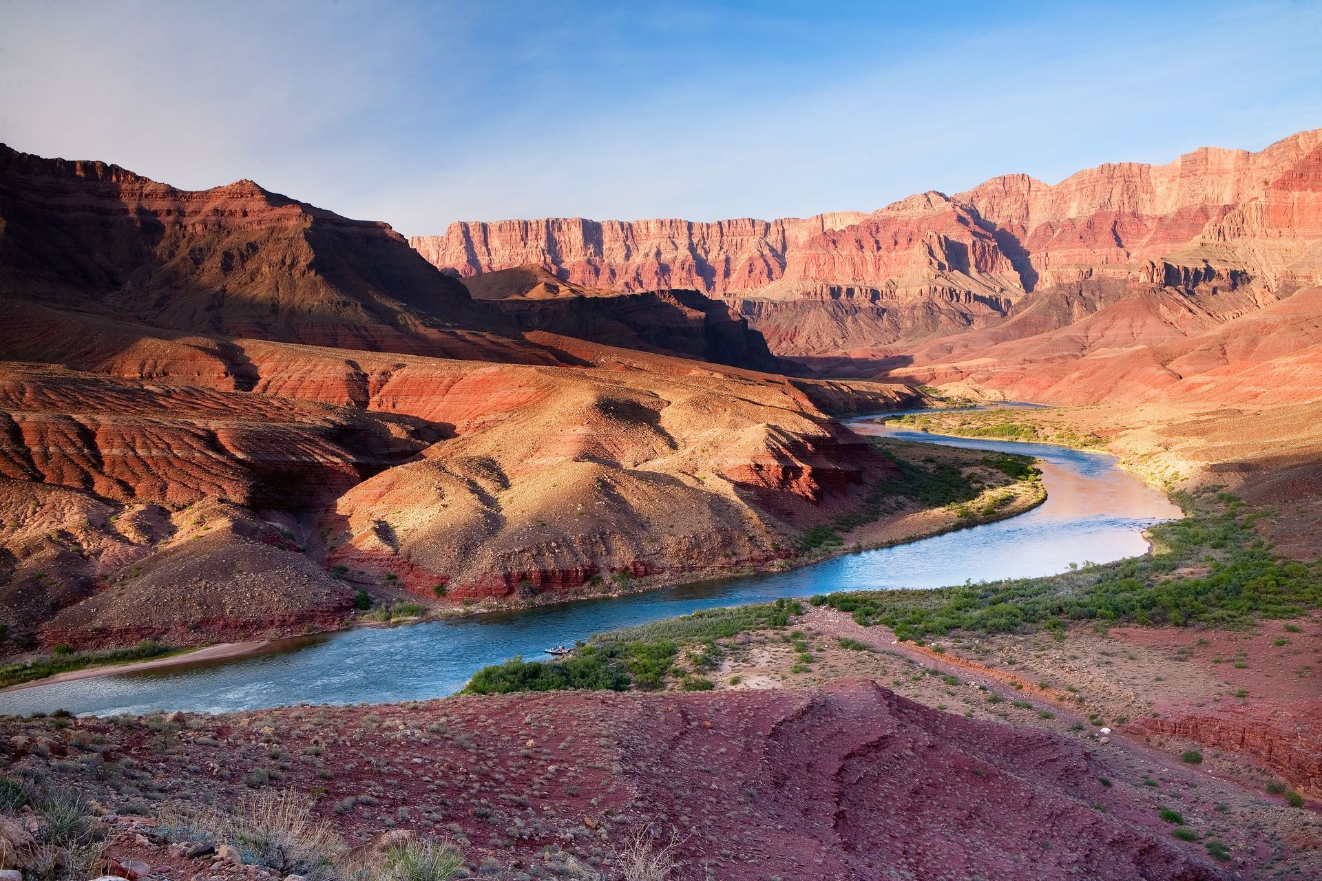 Red rock canyon with blue river winding through; Arizona landscape.