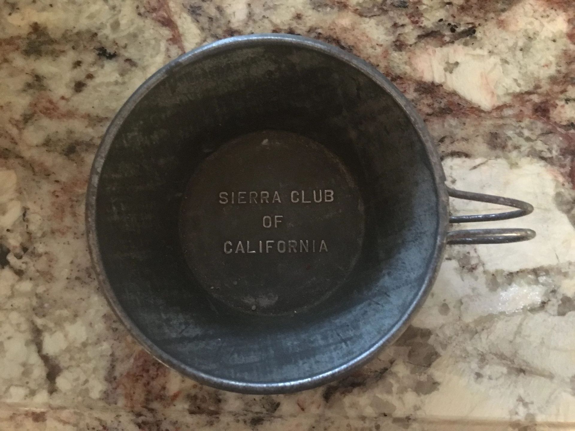 Metal Sierra Club of California cup, viewed from above.
