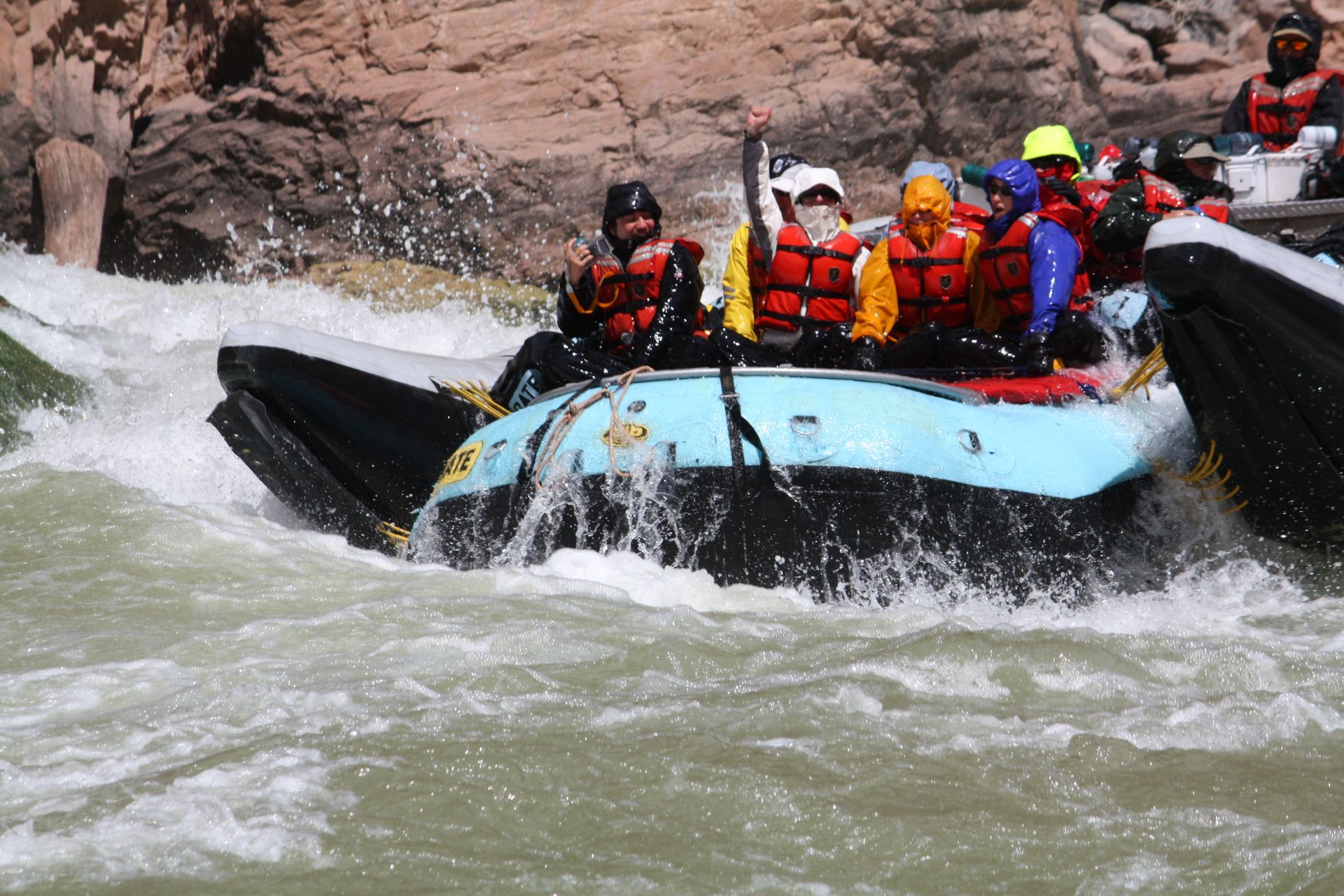 Family taking a photo at the top of the  Desolation Canyon with Green River View at the bottom