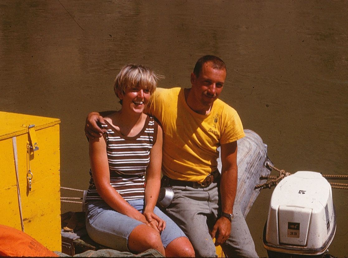 Dave and Vicky seated near on a river