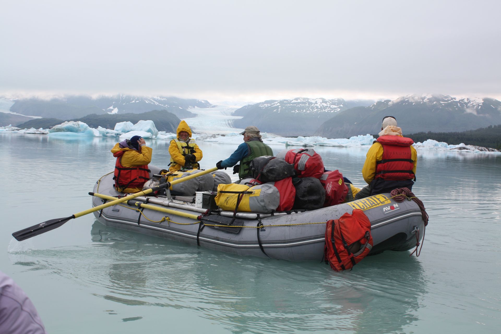 Family taking a photo at the top of the  Desolation Canyon with Green River View at the bottom