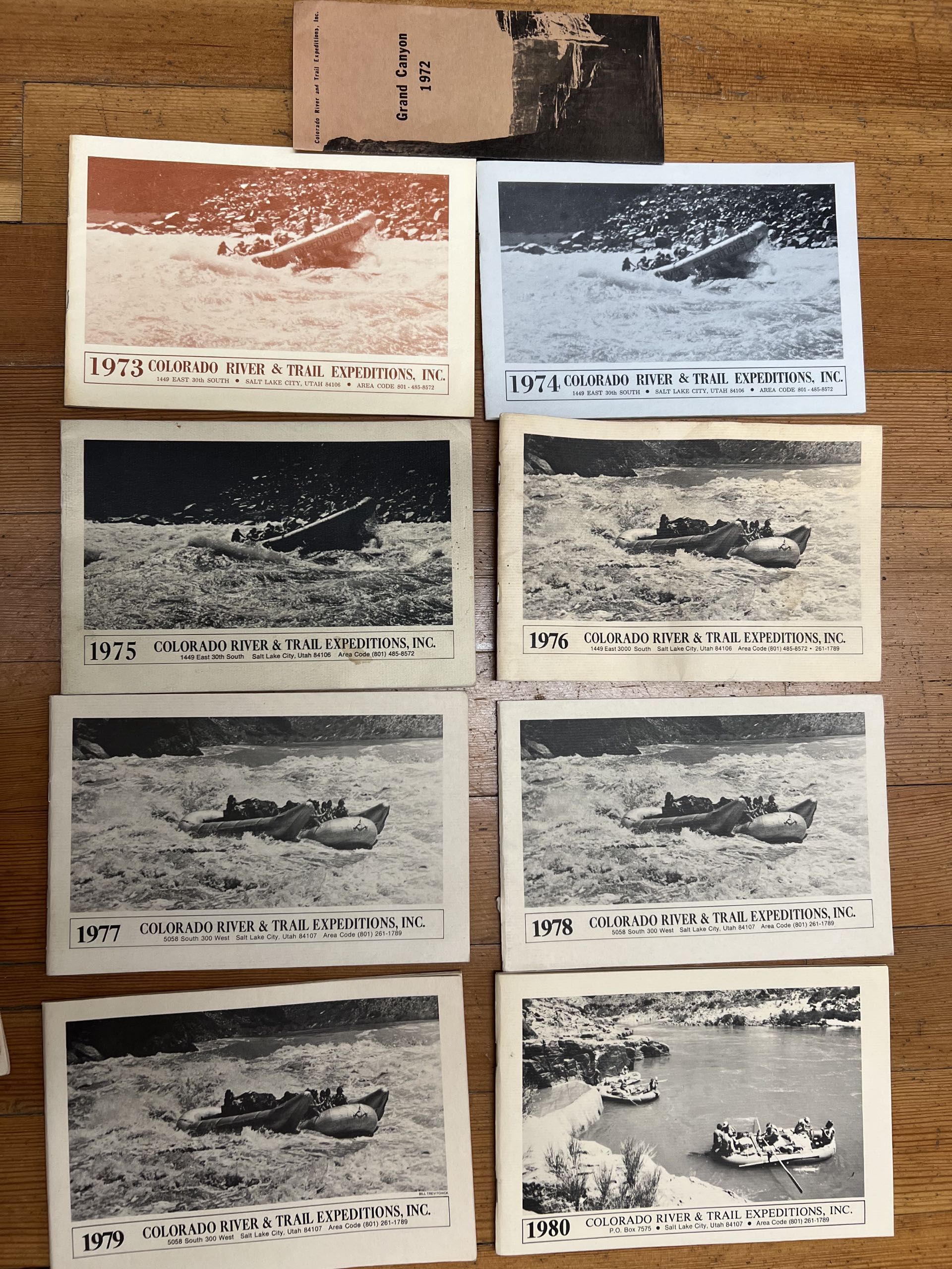 Raft on calm water, red-rock landscape in background