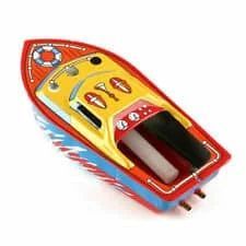 Toy tin speedboat with red, yellow, and blue paint, with a small life preserver on the bow.