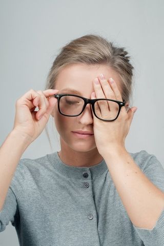 Comprehensive Eye Examinations — Woman Covering Eyes With Hands in San Antonio, TX