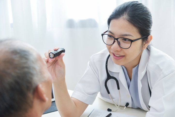 Treatment of Eye Infections / Eye Disease — Checking Senior Man Patient Eyes in San Antonio, TX