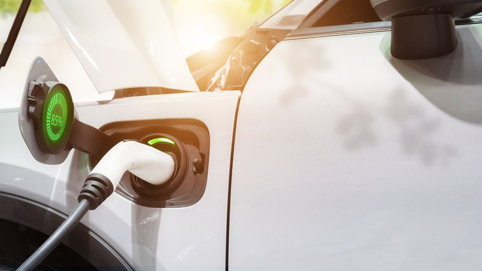 A close up of an electric car being charged.