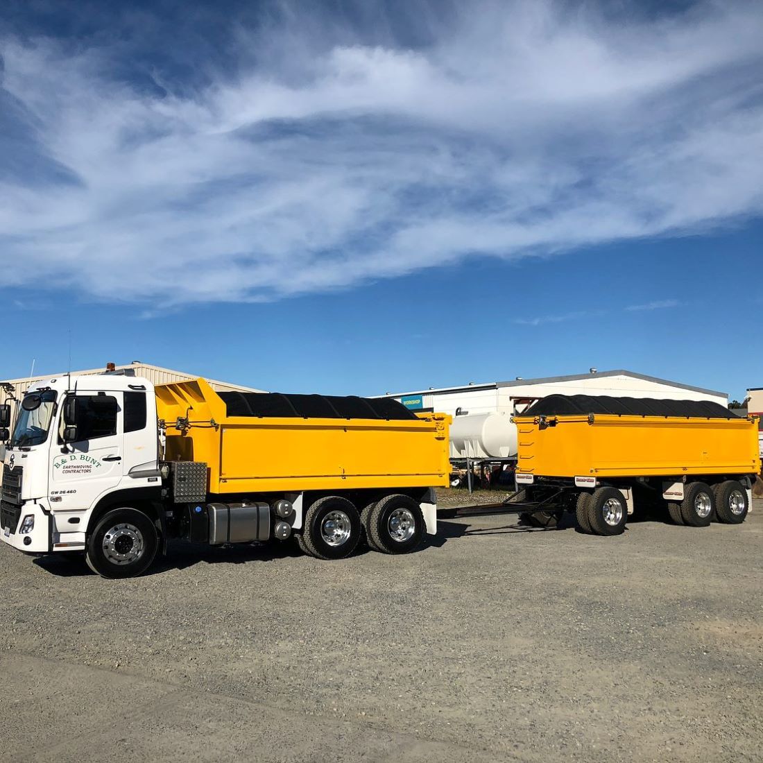 A White Tipper Truck With Yellow Bed and Trailer — B & D Bunt Earthmoving Contractors in Nambucca Heads, NSW