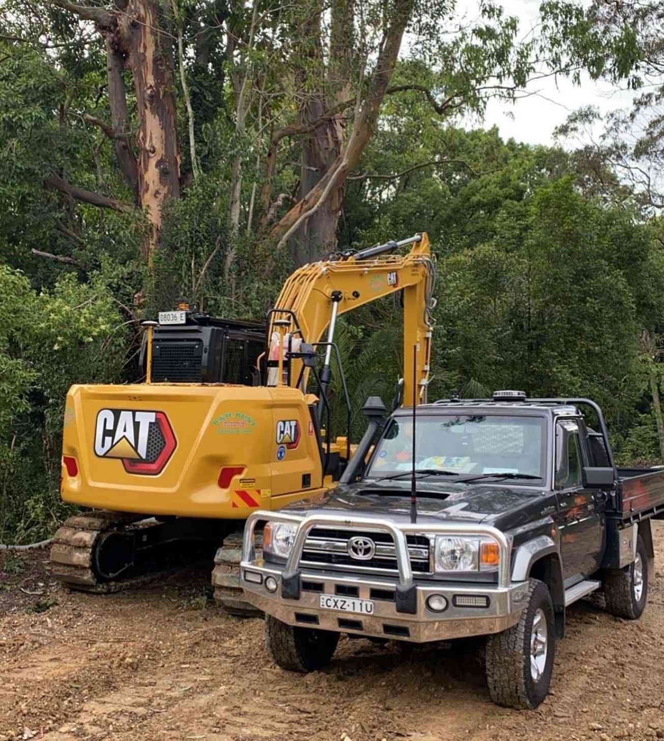 Yellow Excavator is Parked — B & D Bunt Earthmoving Contractors in North Boambee Valley, NSW