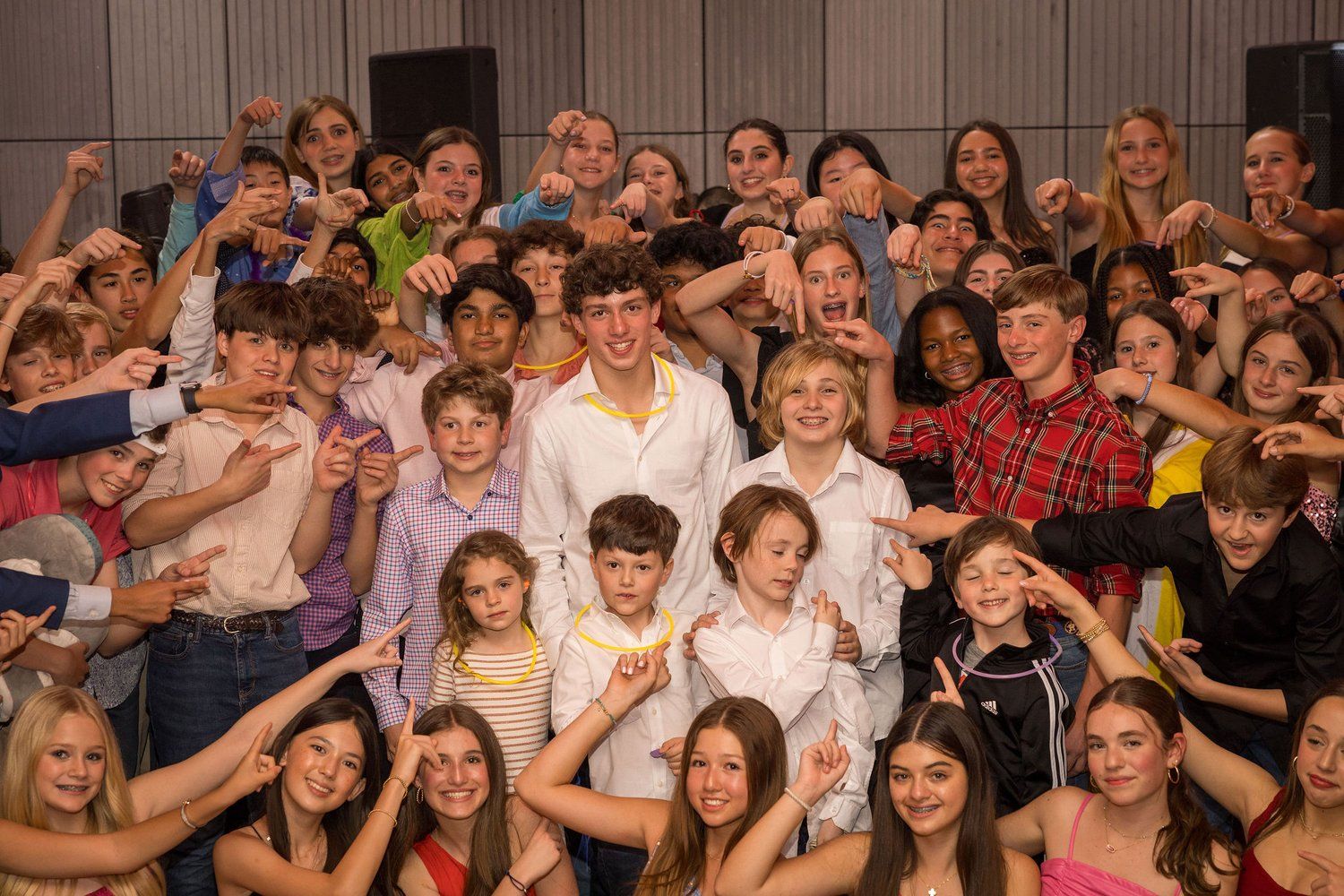 A large group of children are posing for a picture.