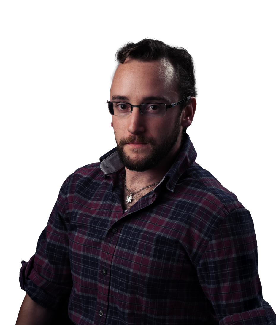 A man with a beard wearing glasses and a plaid shirt