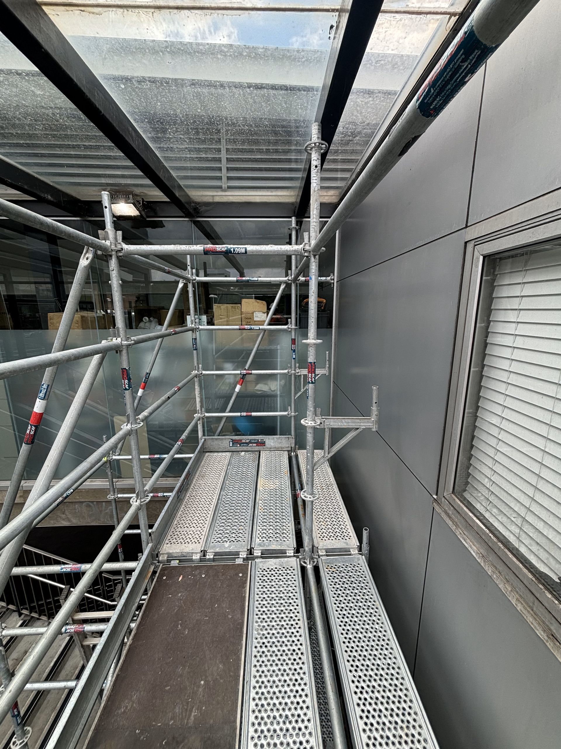 A scaffolding is being built on the side of a building.