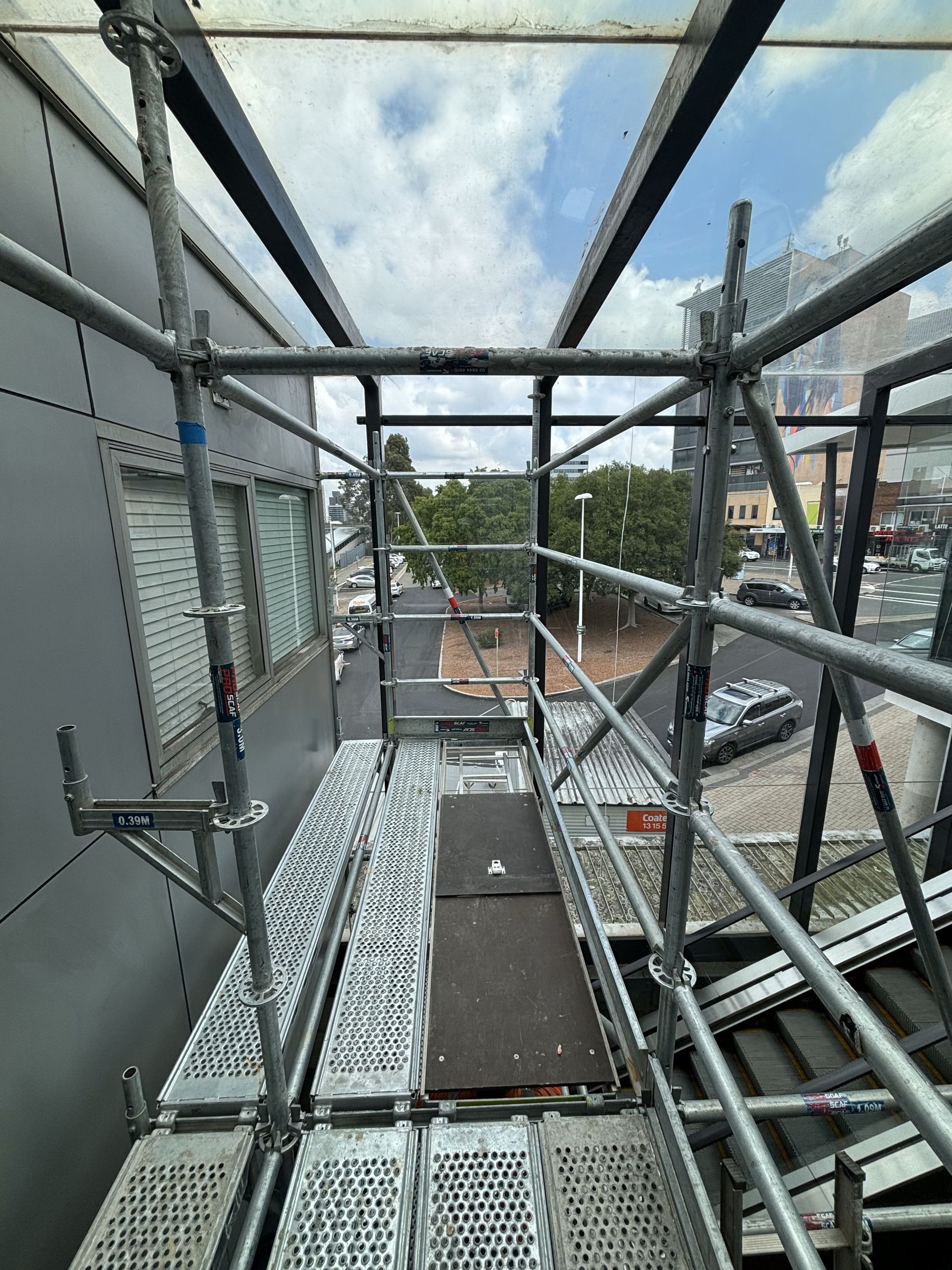 A scaffolding structure is being built on the side of a building.