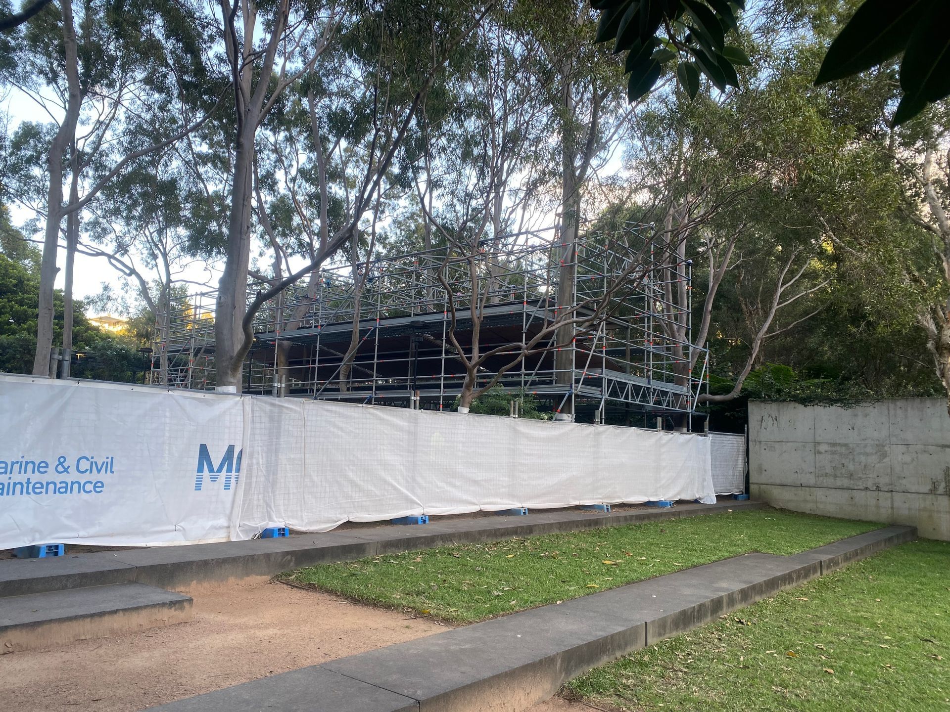 A man standing next to a set of stairs with a sign that says liverpool on it.