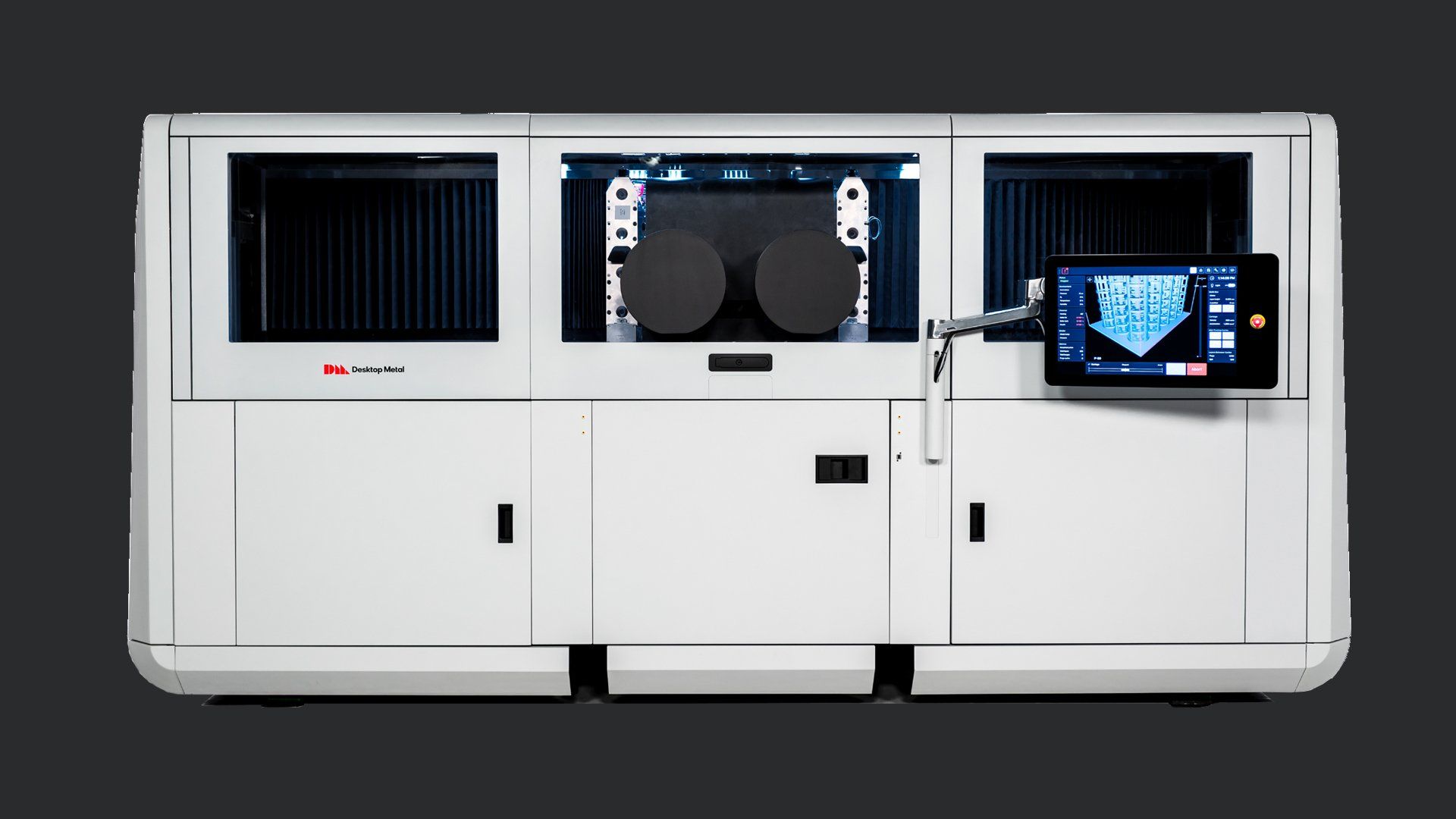 A large white machine with a monitor on top of it