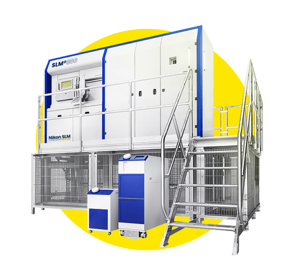 A large white and blue machine with stairs and a yellow circle in the background.