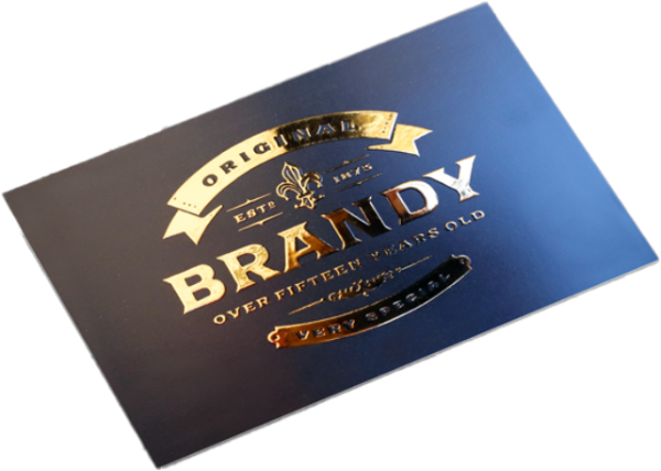 A matte black business card that has gold metallic embossing