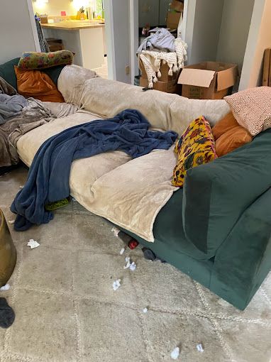 A couch is laying on the floor in a living room.