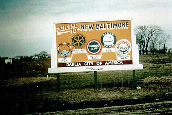 A billboard that says welcome to new baltimore on it