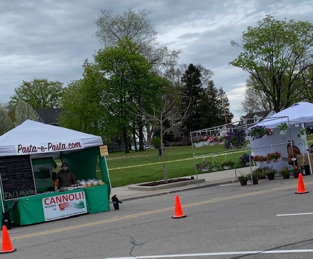 A green cannoli stand sits on the side of the road